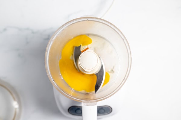 eggs, salt, and vinegar in a food processor bowl