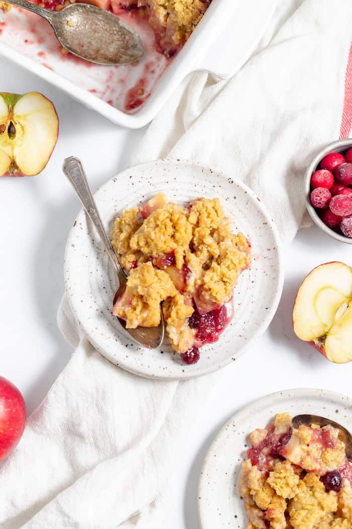 plates of cranberry apple crisp served.