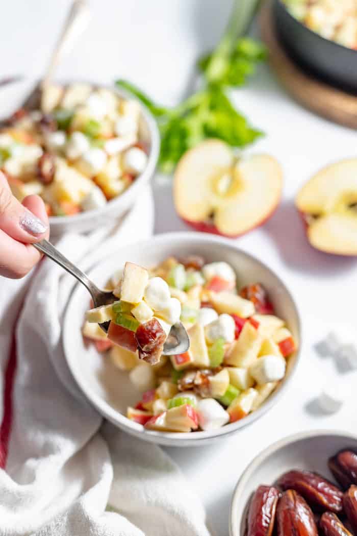 serving a spoonful of apple salad