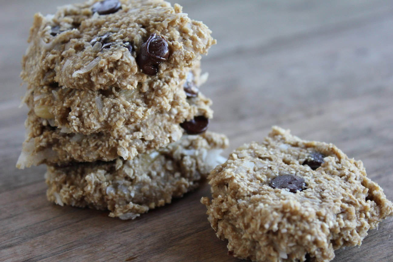 Image shows a close up of a stack of healthy oatmeal cookies on a table 