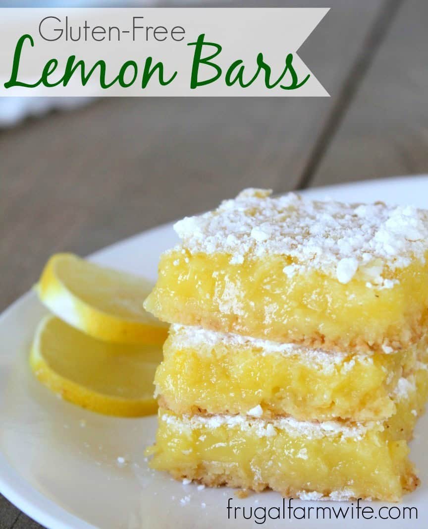 Image shows a close up of lemon bars on a white plate, sprinkled with powdered sugar. Text above reads "Gluten-Free Lemon Bars"