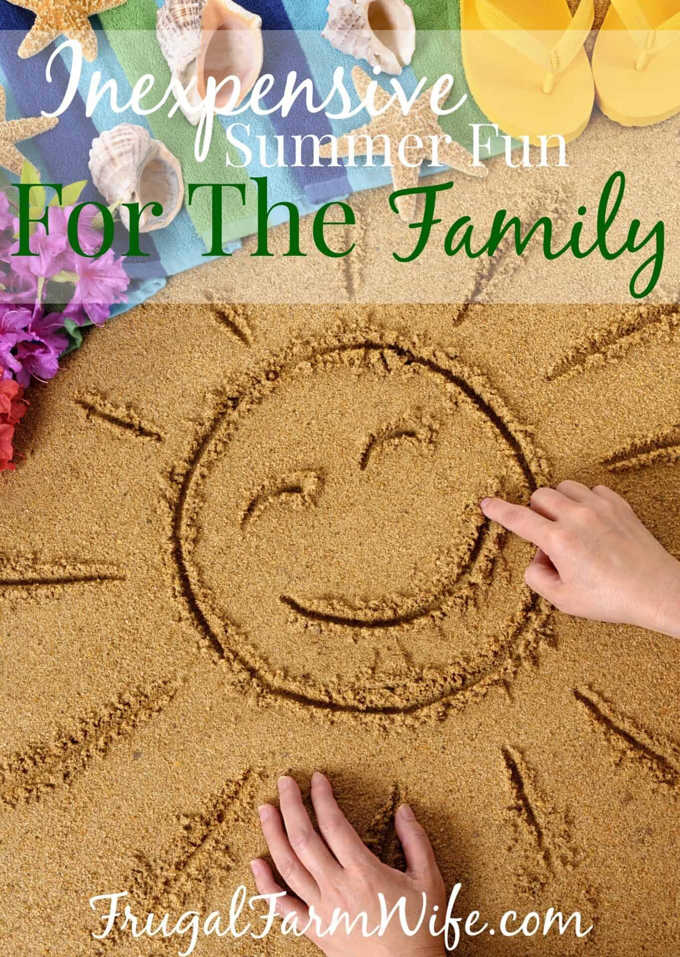 Image shows a hand drawing a sunshine in sand, with text overlay that reads "Inexpensive Summer Fun for the Family"