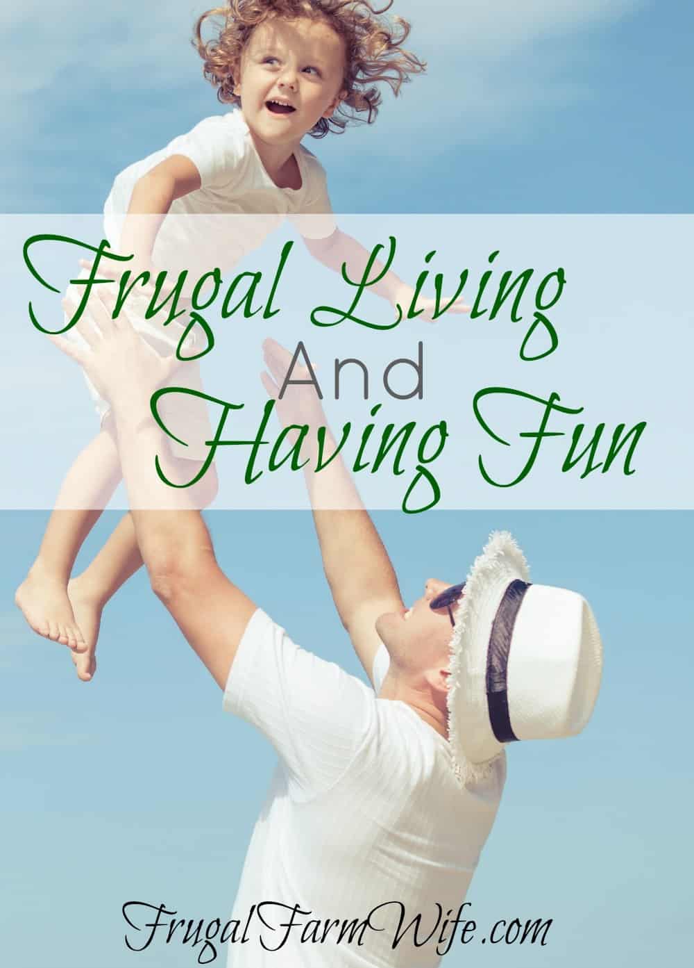 Image shows a man tossing a small child in the air outside in the sun with text that reads "Frugal Living and Having Fun"