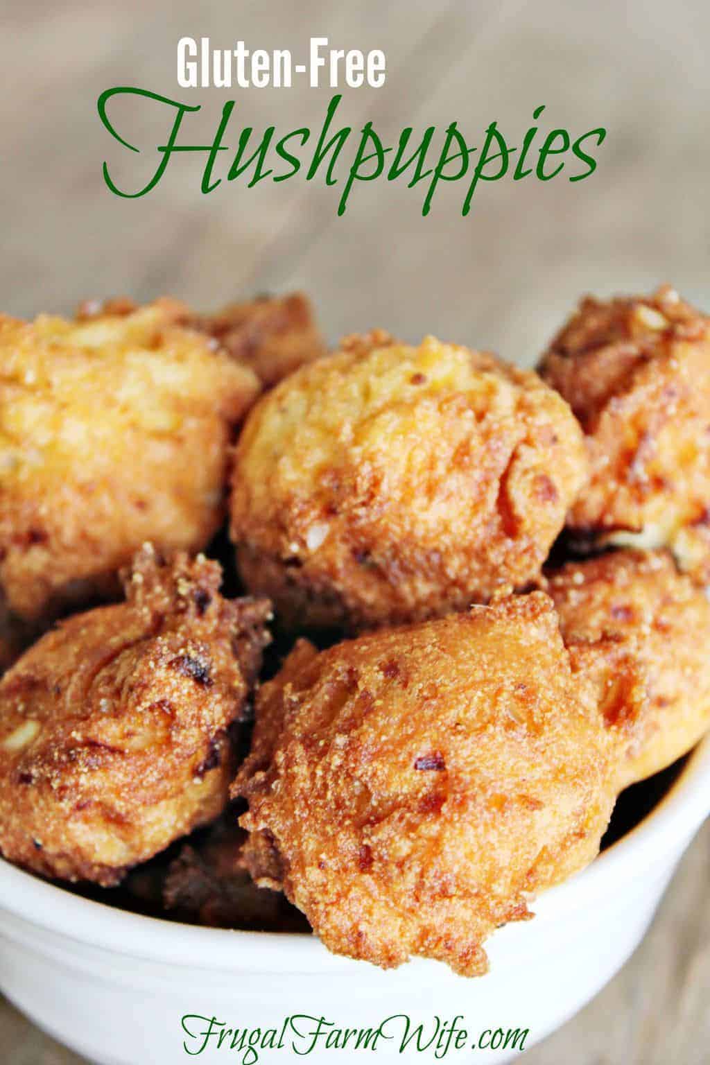 Image shows a close up of homemade gluten free hushpuppies in a white ceramic bowl. Text above reads "Gluten Free Hushpuppies"