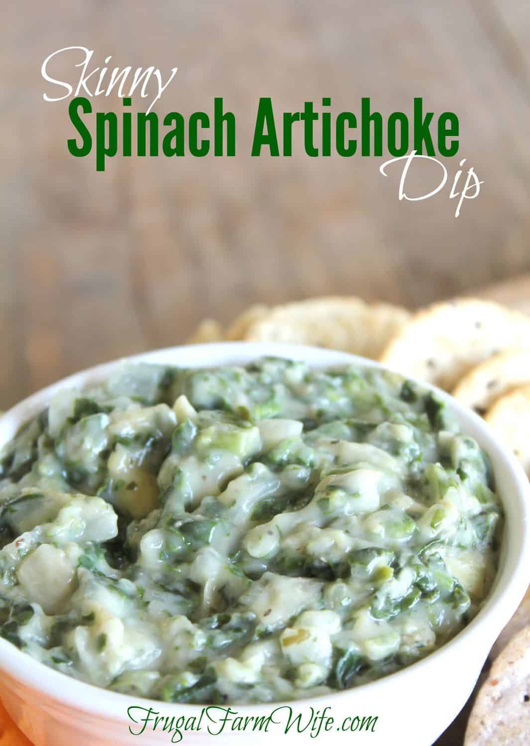 Image shows a close up of a bowl of spinach artichoke dip with some pieces of bread next to it. Text above reads "Skinny Spinach Artichoke Dip"