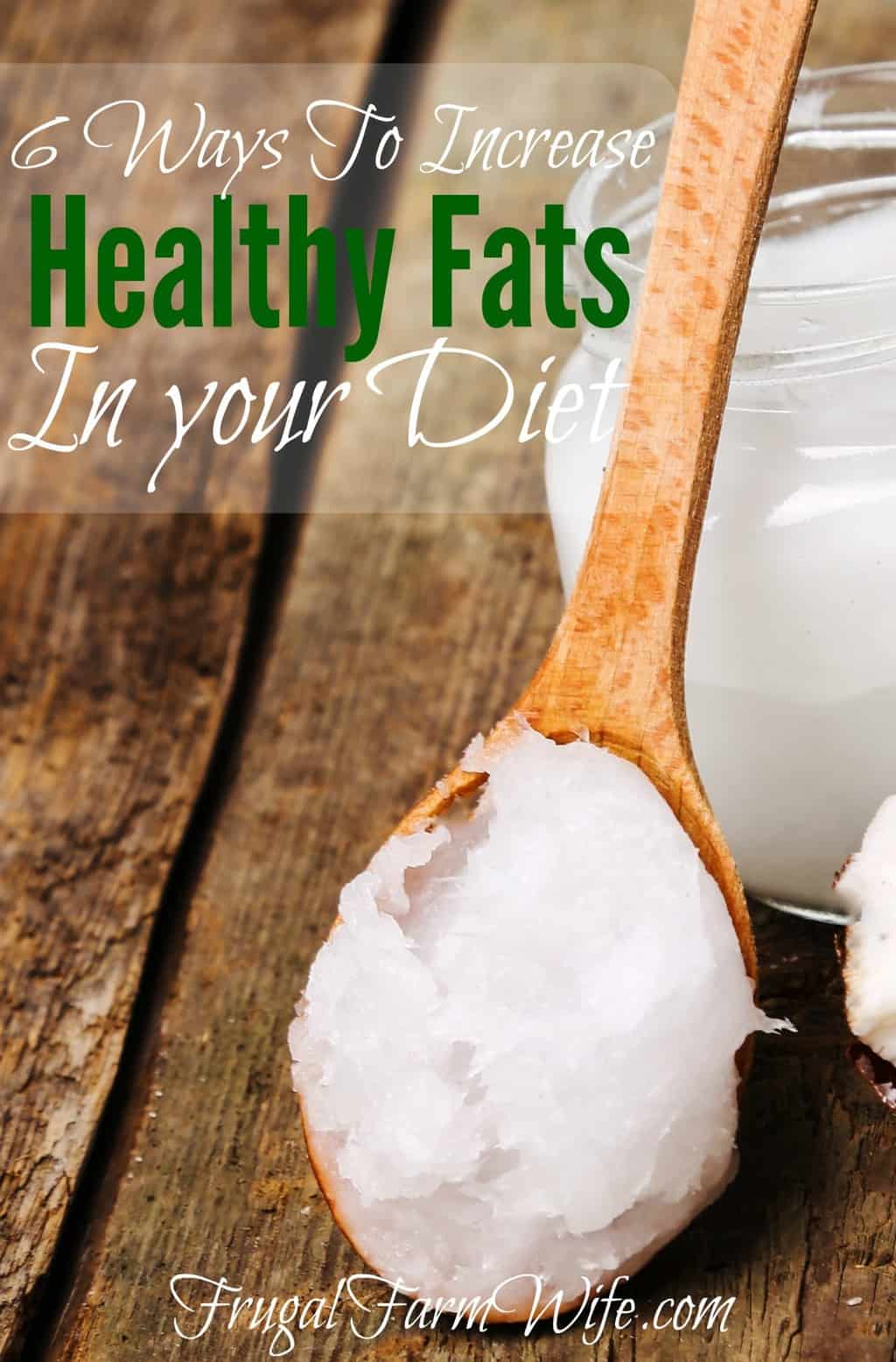Image depicts a spoonful of coconut oil on a wooden spoon leaning against a jar, with the text  above that reads "6 Ways to Increase Healthy Fats in Your Diet"