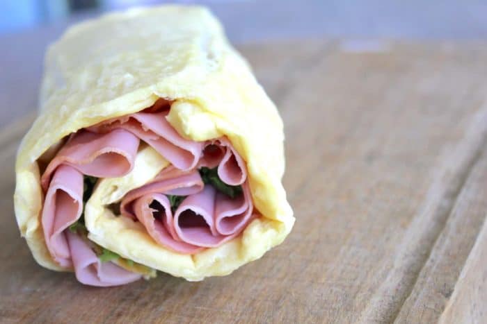 Photo shows a close up of a sandwich wrap on a gluten free wrap