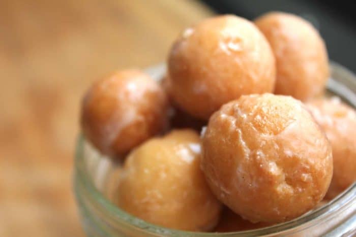 Image shows a close up shot of gluten-free doughnut holes