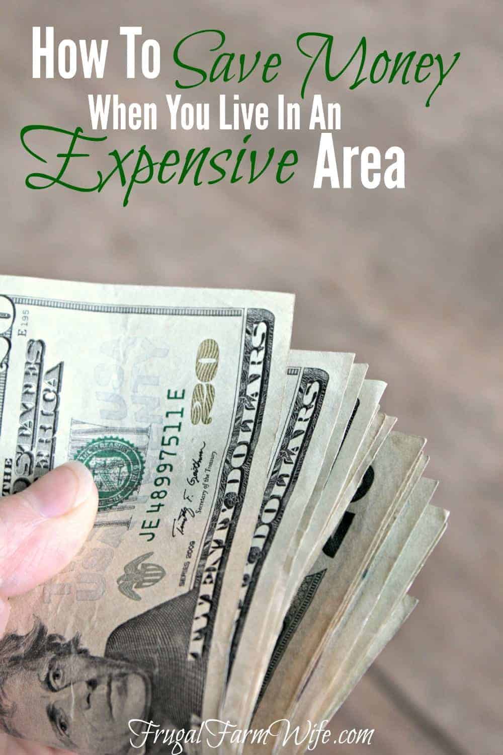 Image shows a hand holding a stack of $20 bills, text overlay reads "How to save money when you live in an expensive area"