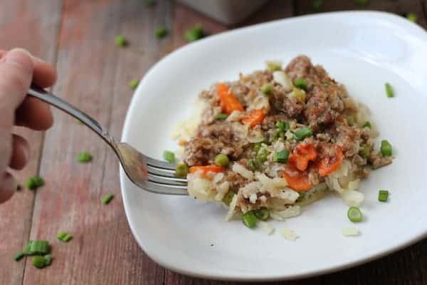 Image shows a fork taking a bite of upside-down shepherd's pie