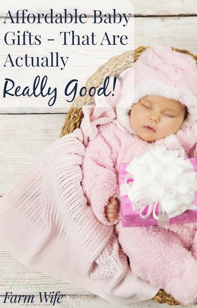Image shows a baby bundled in pink sleeping in a basket. Text overlay reads "Affordable Baby Gifts- That are Actually Really Good!"