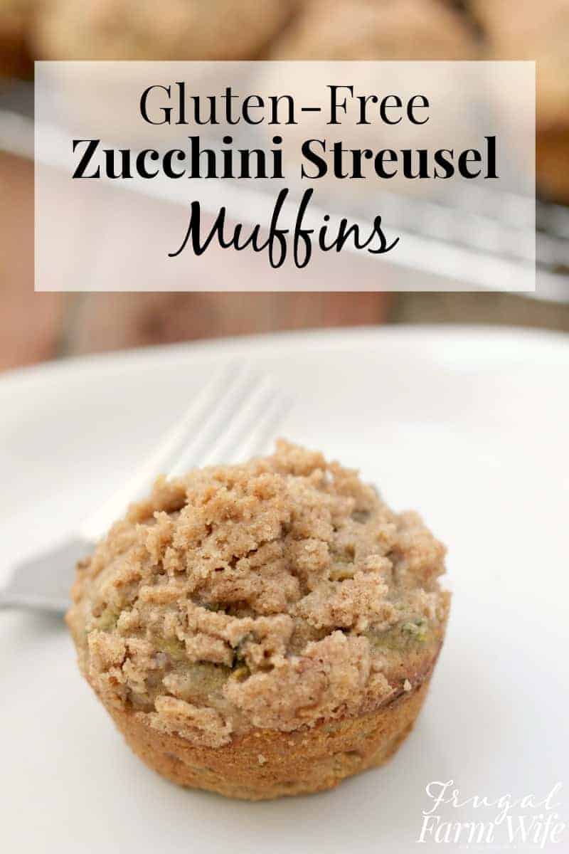 Image shows a close up of a zucchini streusel muffin on a plate with text above that reads "Gluten Free Zucchini Streusel Muffins"