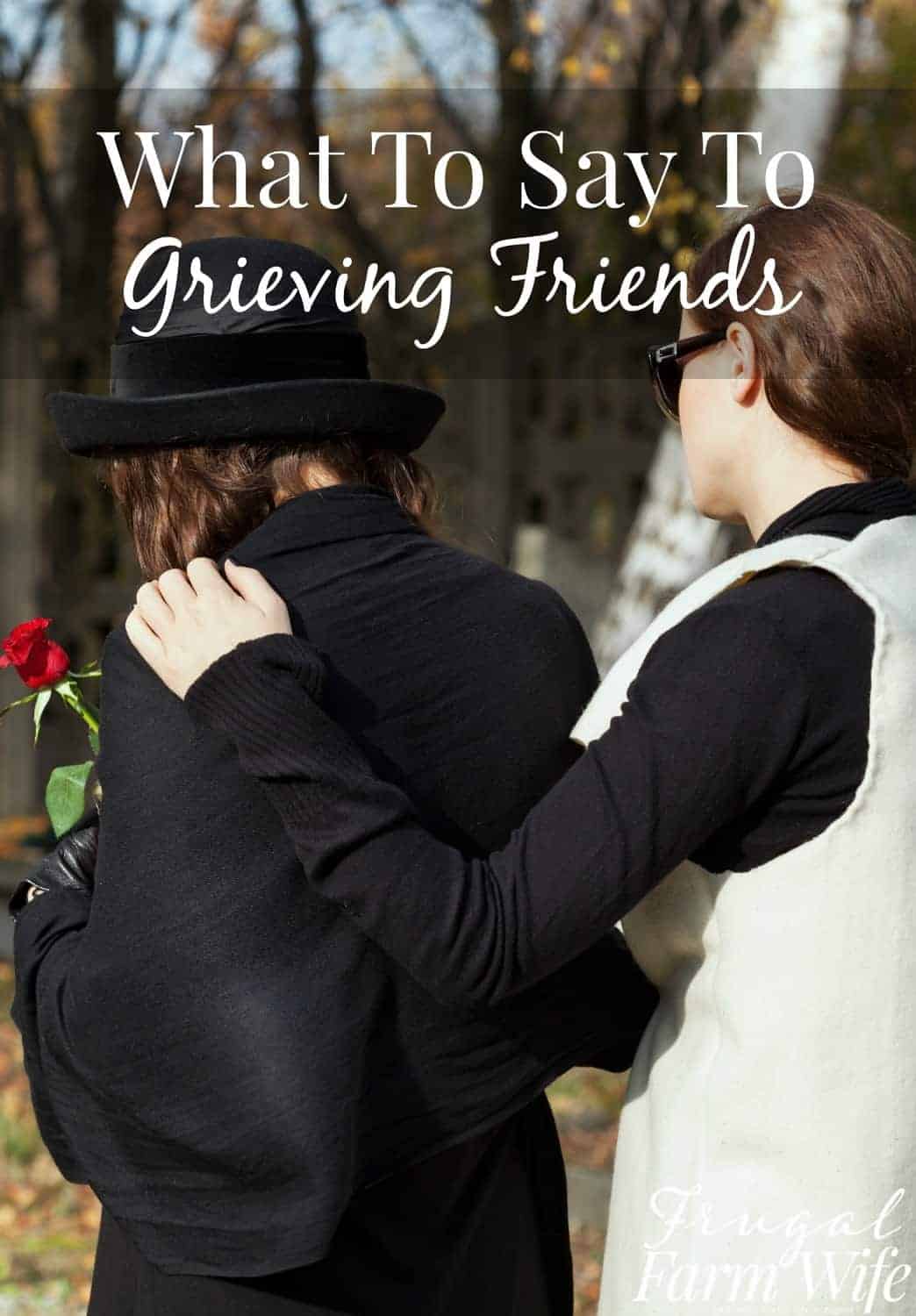 Image shows two women from behind outdoors, one has her arm over the shoulder of the other, who is looking down and holding a flower. Text overlay reads "What To Do For Grieving Friends"