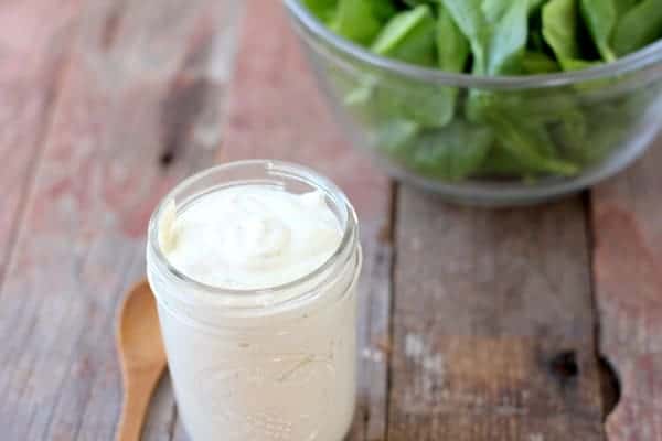 Image shows a jar of ranch dressing on a table