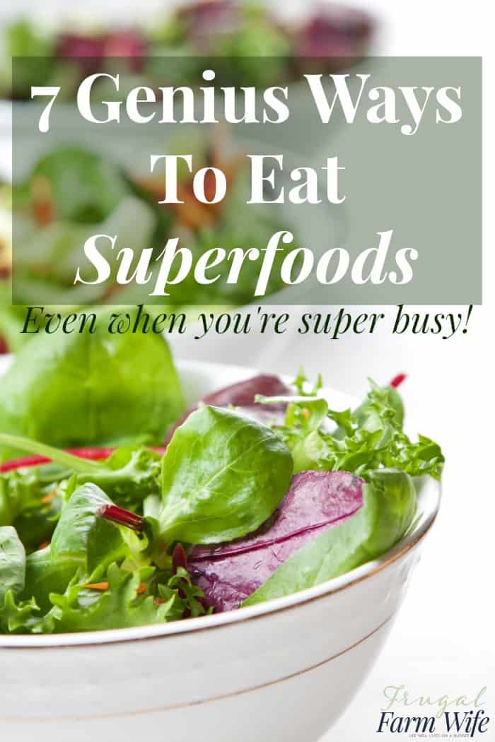 Image shows a close up of a bowl of leafy green salad, with text overlay that reads "7 Genius ways to make sure you eat your superfoods - even when you're super busy!"