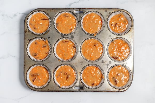 carrot cupcake batter in pan ready to bake
