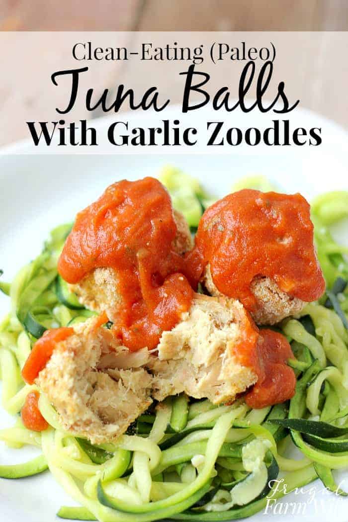 Photo shows a close up of a plate of zoodles with tuna balls and red sauce on top. Text above reads "Clean-Eating (Paleo) Tuna Balls with Garlic Zoodles"