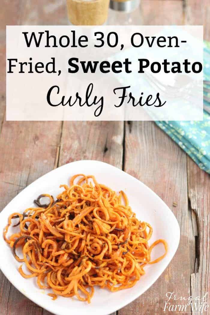 Image shows a plate of curly fries on a table, with text that reads "Whole 30, oven-fried, sweet potato curly fries"