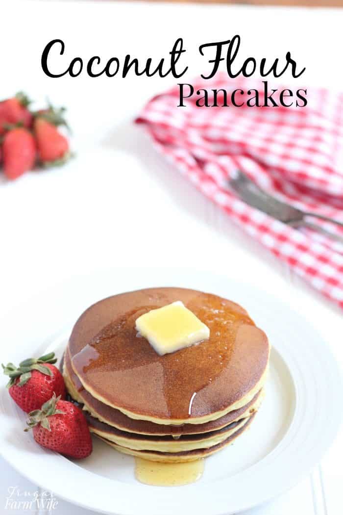 Image shows a stack of pancakes on a plate, with text that reads "Coconut Flour Pancakes"