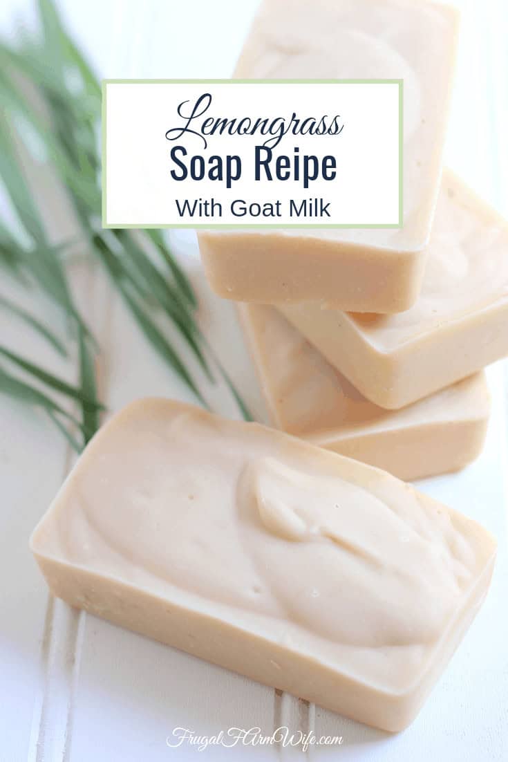 Photo shows several bars of off white lemongrass goat milk soap stacked on a white shiplap board. Text overlay reads "Lemongrass Soap Recipe with Goat Milk"
