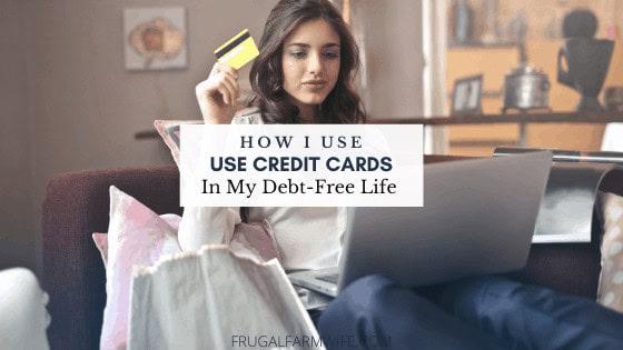 Image shows a woman sitting at a laptop, holding a credit card in her hand. Text overlay reads "How I use Credit Cards While Debt-Free"