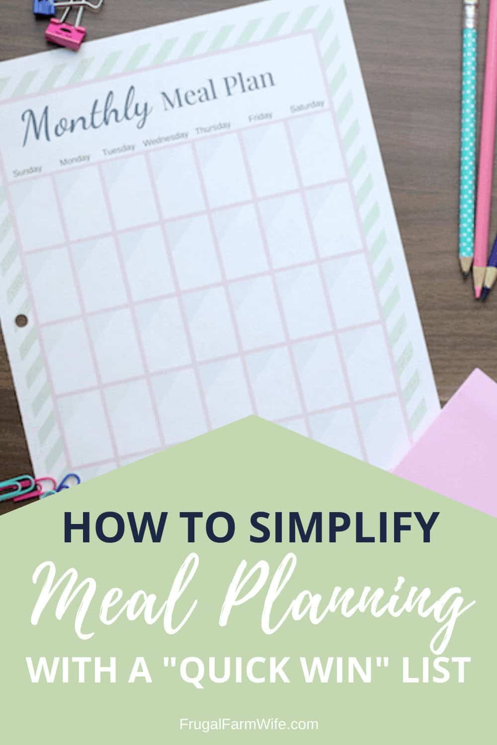 Image shows a print out of a monthly meal plan on a desk, with pencils and paper clips nearby. Text overlay reads "How to Simplify Meal Planning with a 'Quick Win' List"