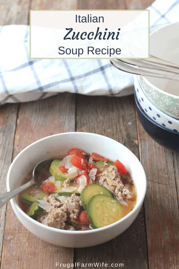 Picture shows a white bowl of zucchini soup on a table, with text that reads "Italian Zucchini Soup Recipe"