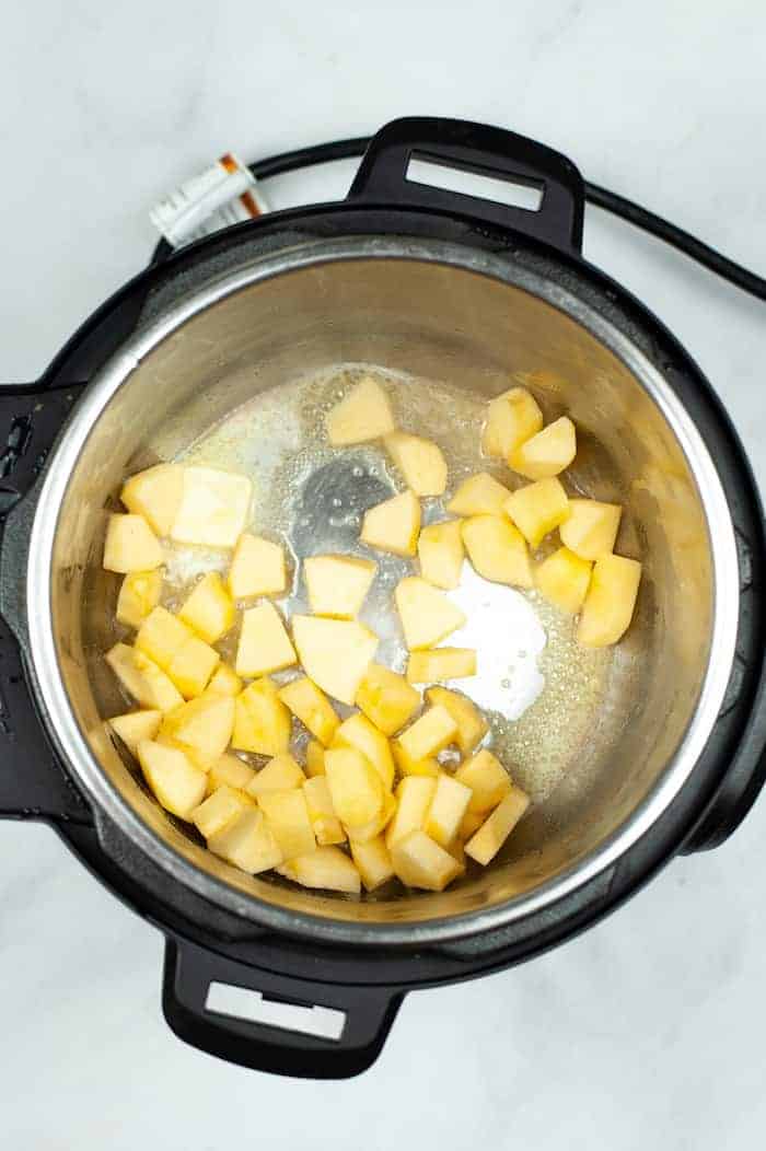 Photo shows apple pieces being sauteed in the Instant Pot 