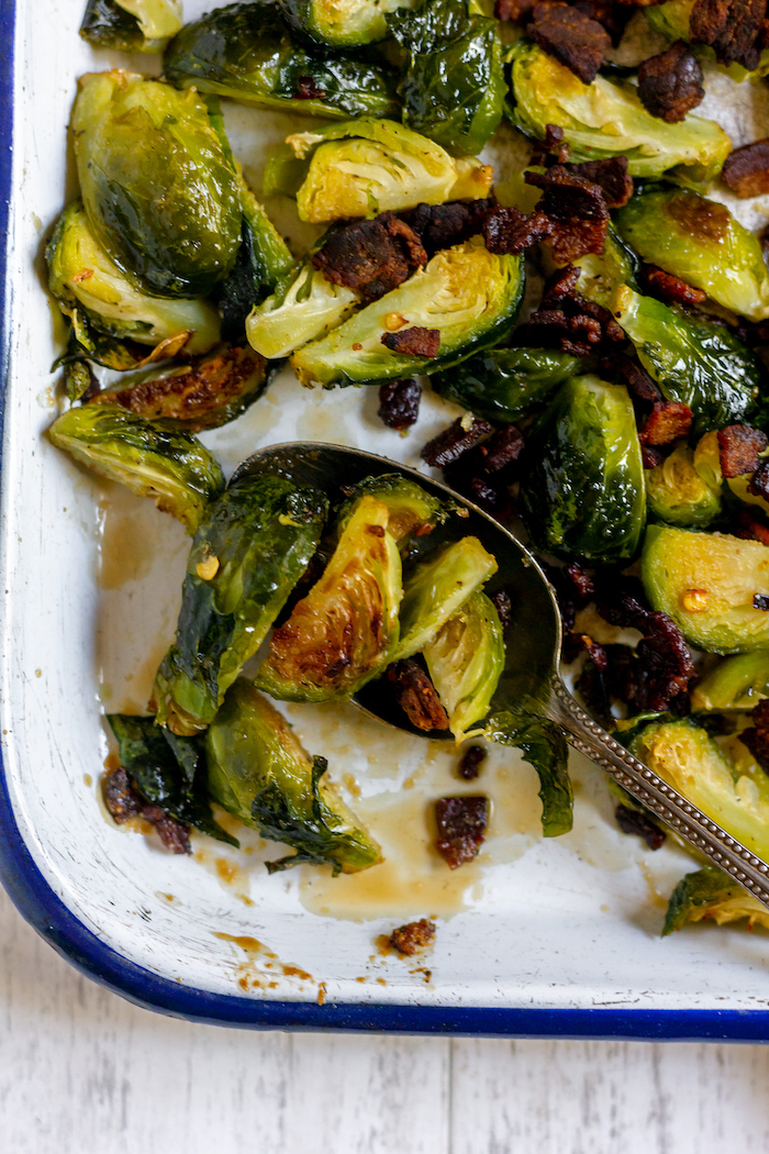 Image shows a close up of brussels sprouts with maple glaze
