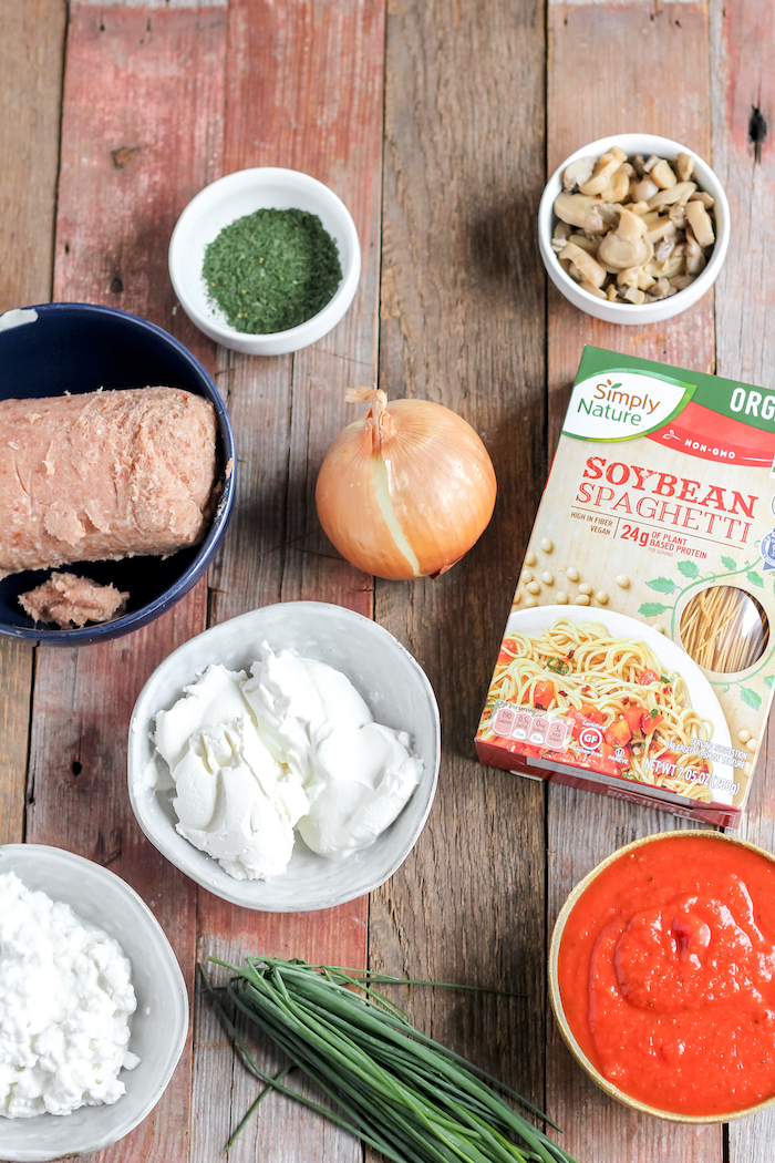 Images shows a table full of ingredients for baked spaghetti