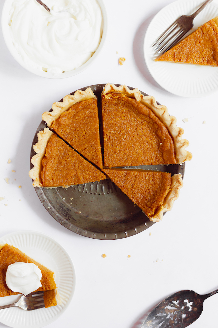 Photo shows a sweet potato pie, sliced and served on plates