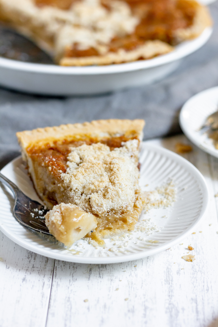 Photo shows a slice of pie on a plate with one bite on a fork