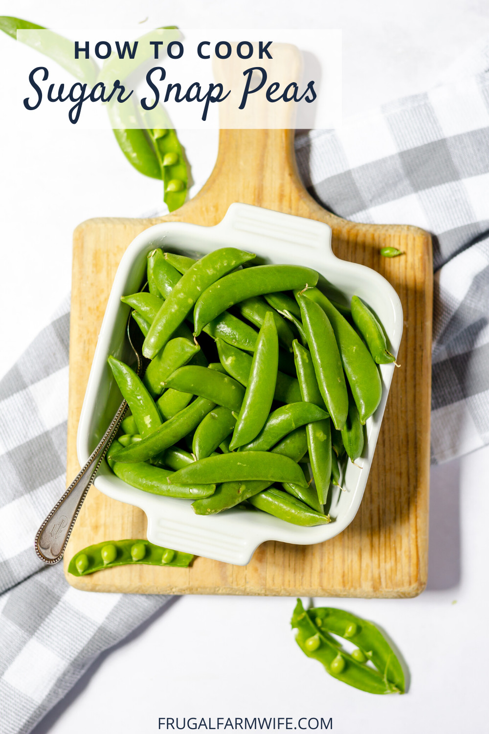 Image shows a wooden cutting board on a checkered tablecloth. On the board is a white, square bowl full of sugar snap peas. Text overlay reads "How to cook sugar snap peas"