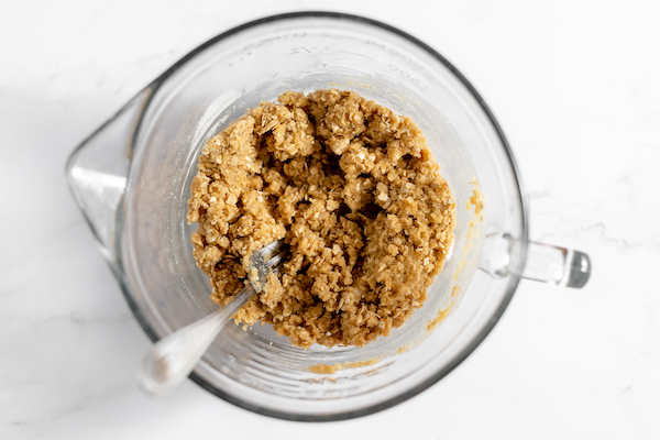 Image, taken from above, shows the blackberry crisp mixed together with the butter and dry ingredients. 