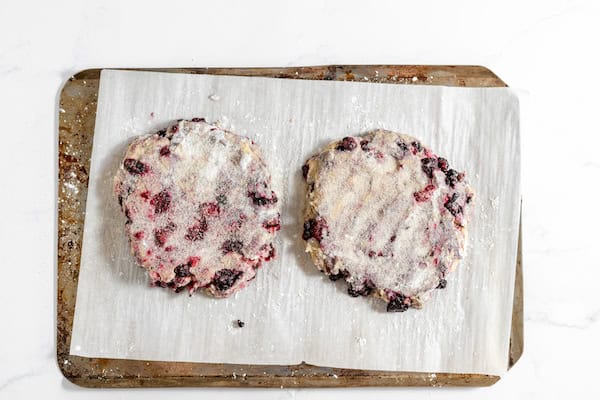 Image taken from above shows dough for scones pressed into circles and ready to cut