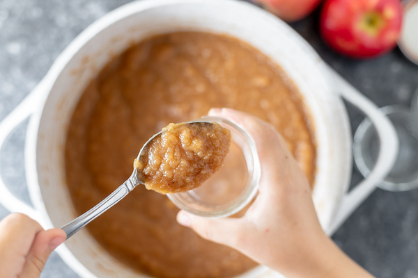 putting apple butter in canning jars