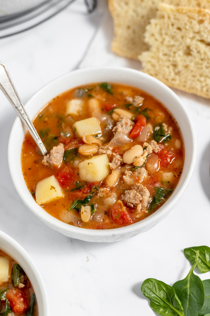 bowls of peasant soup with bread