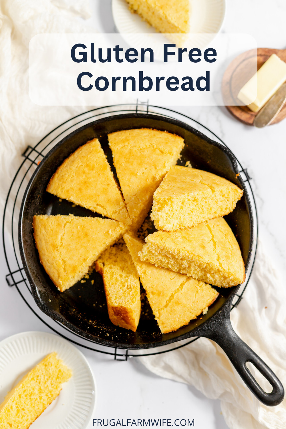 Image, taken from above, shows a cast iron skillet with slices of gluten free corn bread stacked on one another. 