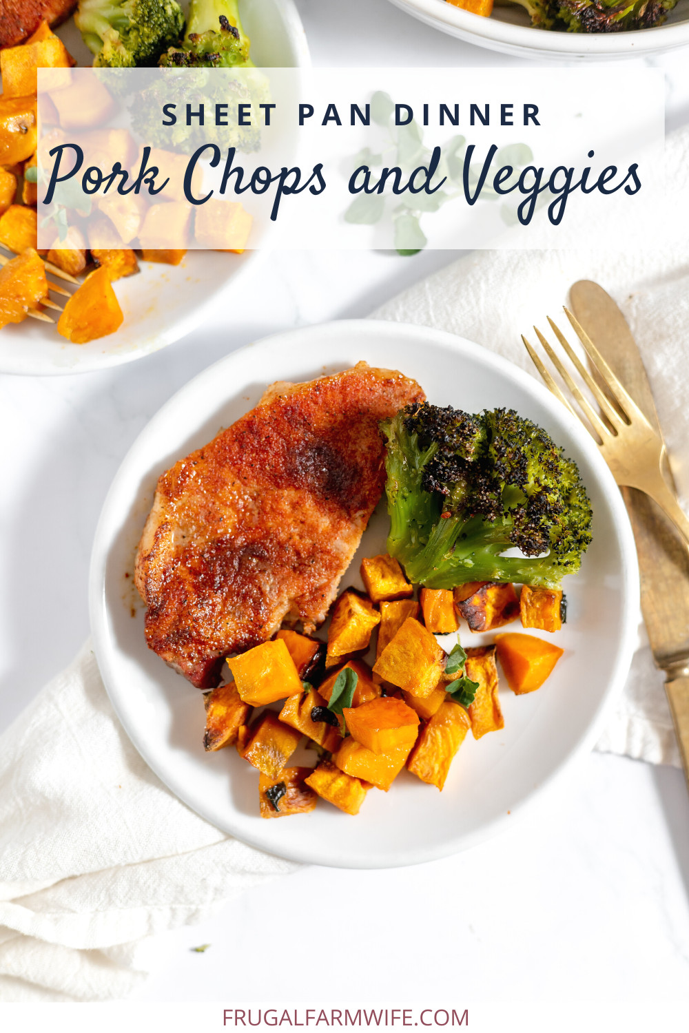 Image shows a white plate on a table with a pork chop, broccoli, and sweet potatoes on it. Next to the plate sits a fork and knife. Text overlay reads "Sheet Pan Dinner Pork Chops and Veggies"