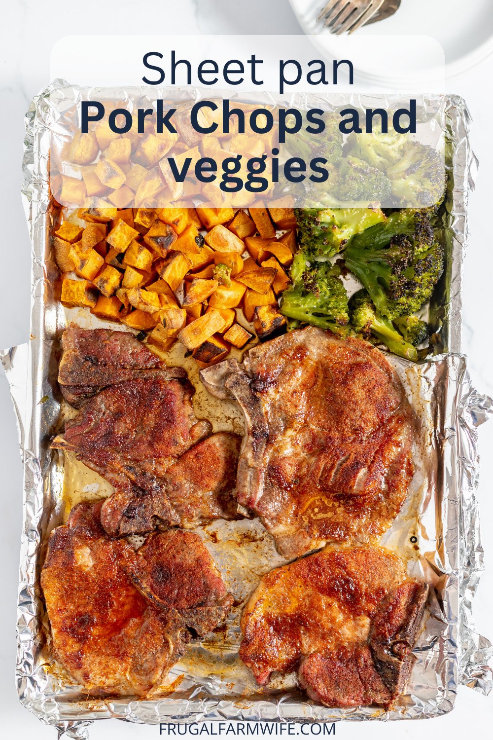 Image, taken from above, shows a sheet pan with potatoes, broccoli and roasted pork chops. Text overlay reads "Sheet pan pork chops and veggies"