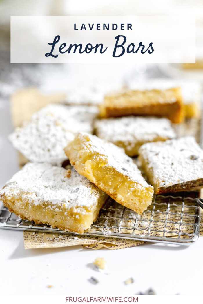 Image shows a pile of lavender lemon bars on a cooling rack, sprinkled in powdered sugar. Text above reads "Lavender Lemon Bars" 