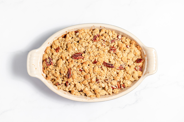 Image, taken from above, shows the gluten free peach crisp ready to be served. 