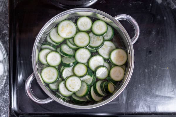 zucchini in a boiling water bath for blanching