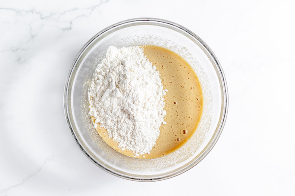 Image, taken from above, shows the dry ingredients added to wet ingredients for gluten free blondies