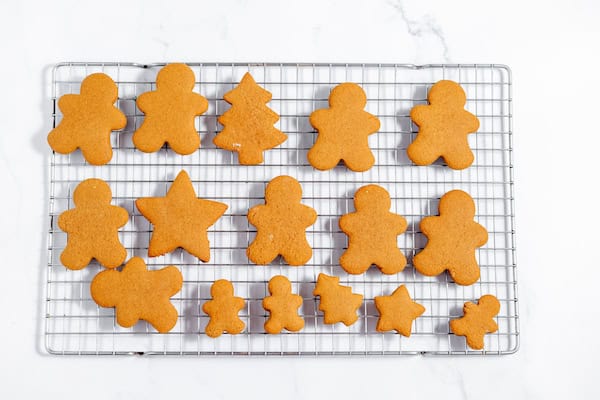 Image, taken from above, shows gluten-free gingerbread cookies cooling on a wire rack