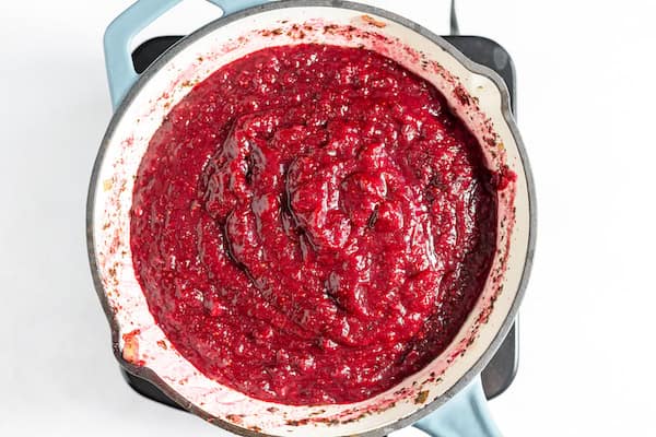 Image, taken from above, shows the cranberry barbecue sauce in a skillet after everything has been blended together. 