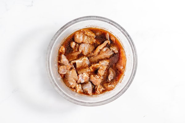 strips of alligator meat in marinade