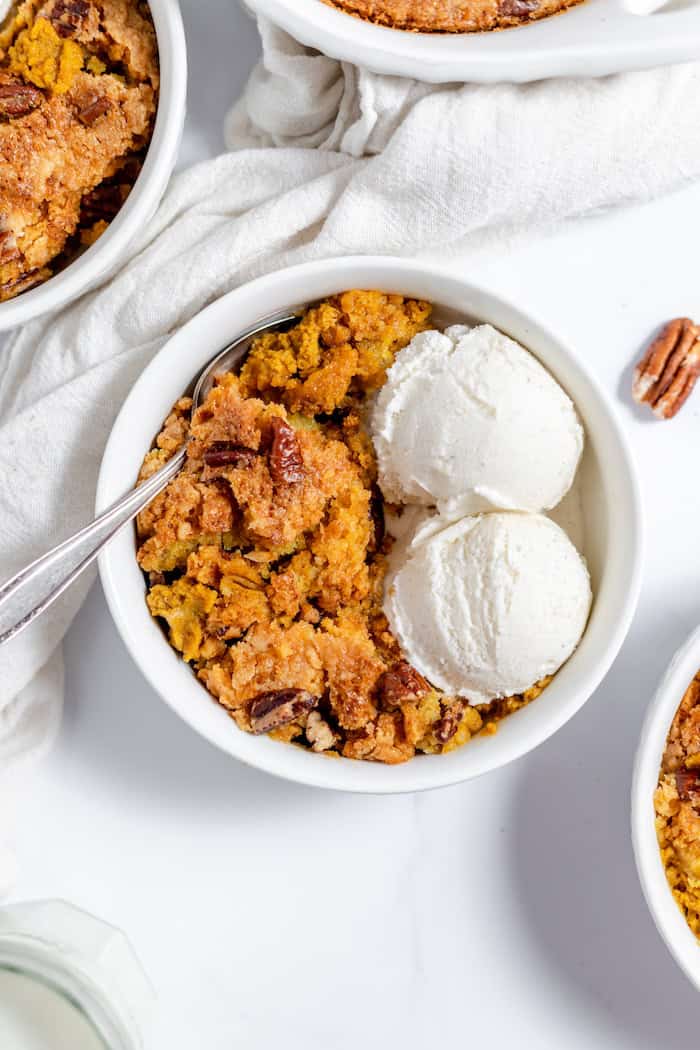 bowls of ice cream and pumpkin dump cake