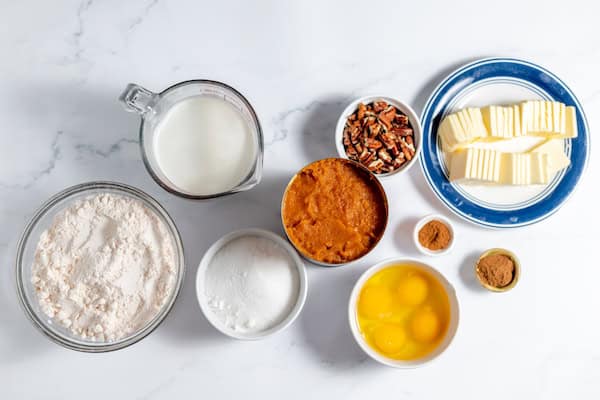 ingredients to make easy pumpkin dump cake on a table