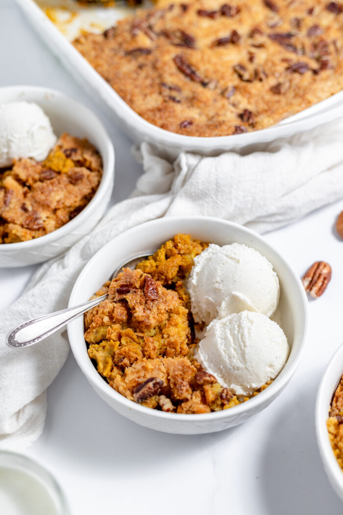 pumpkin dump cake served with ice cream